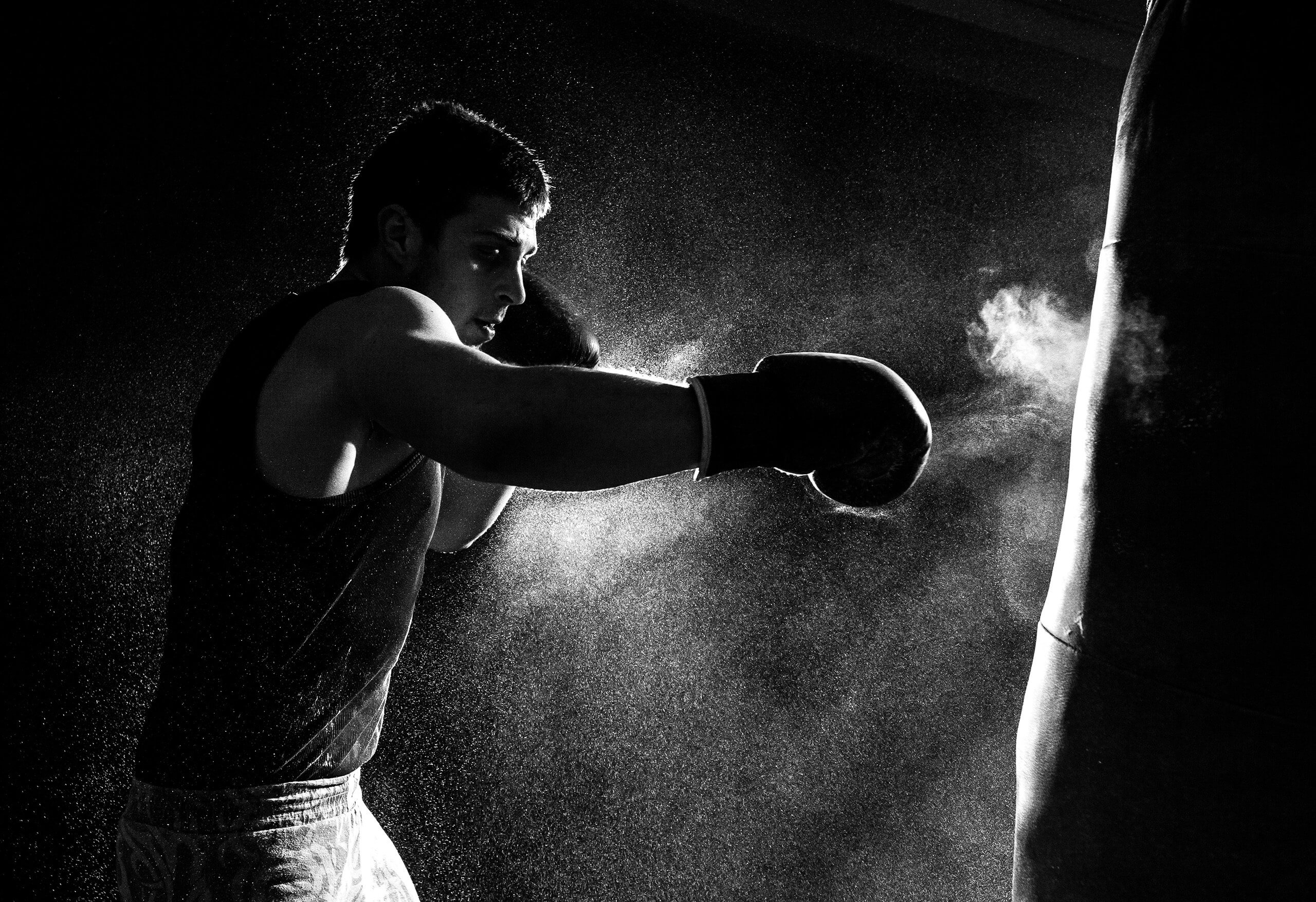 A boxer hitting a punching bag